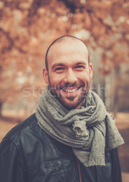 Positive middle-aged man alone on beautiful autumn day Stock photo © Nejron