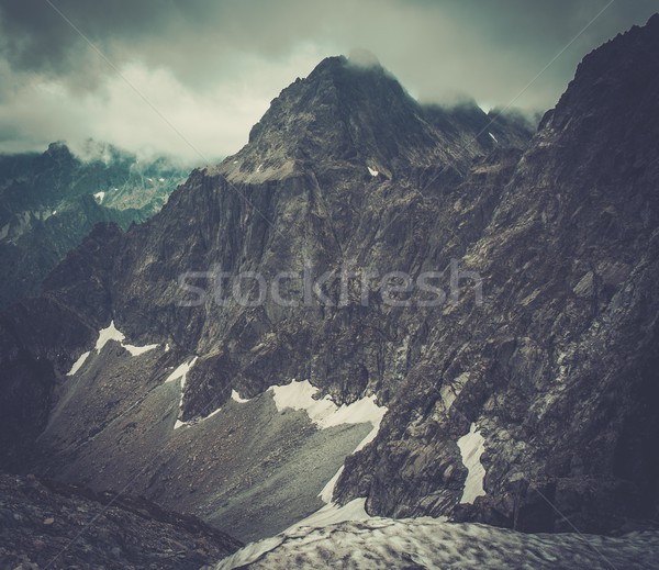 Fog over high mountain peak  Stock photo © Nejron