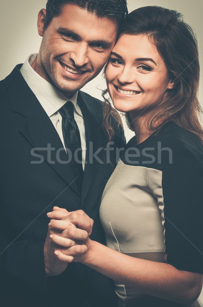 Happy smiling couple in suit and dress  Stock photo © Nejron