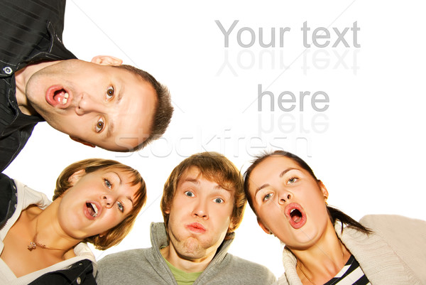 Group of happy friends making surprised faces Stock photo © Nejron