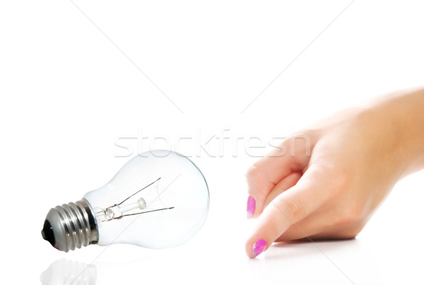 Beautiful woman's hand pointing to something isolated on white b Stock photo © Nejron