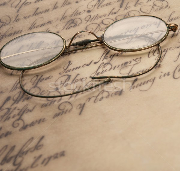Old glasses on the vintage document Stock photo © Nejron