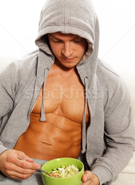 Człowiek szary muskularny tułowia jedzenie Zdjęcia stock © Nejron