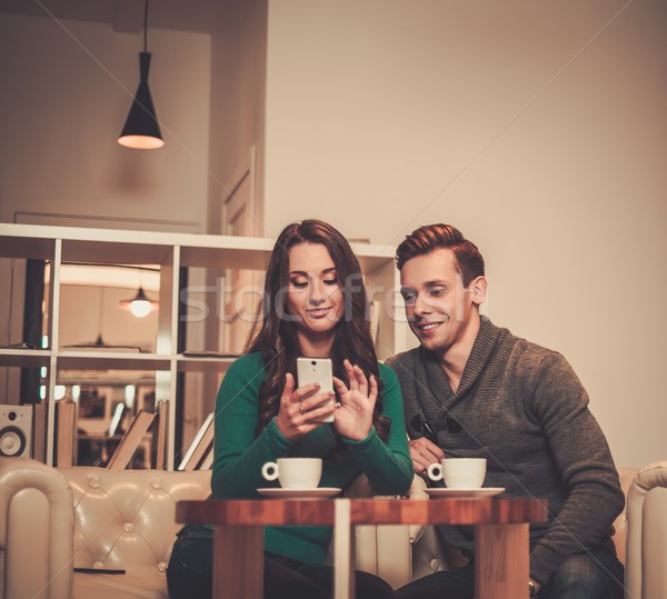 Young couple looking something in mobile phone  Stock photo © Nejron