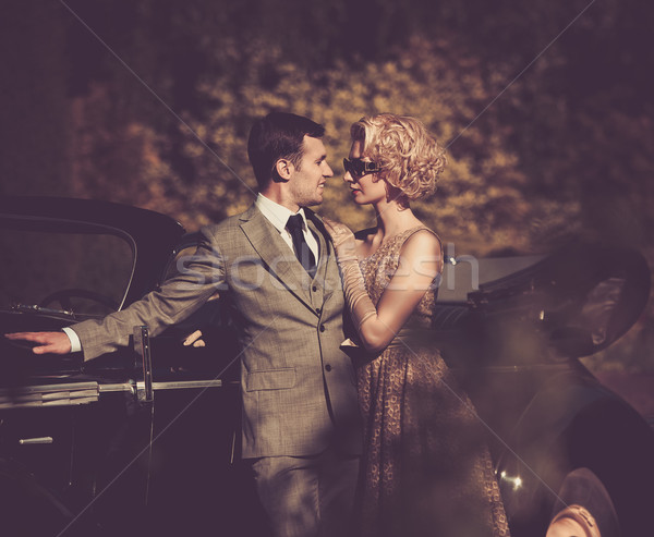 Couple near a retro car outdoors Stock photo © Nejron