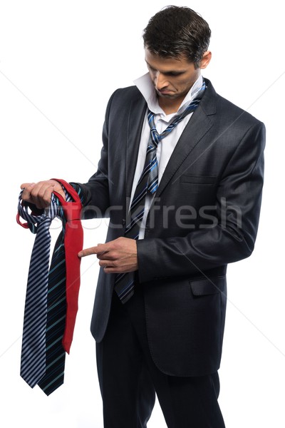 Bewildered handsome man in black suit and choice of ties  Stock photo © Nejron