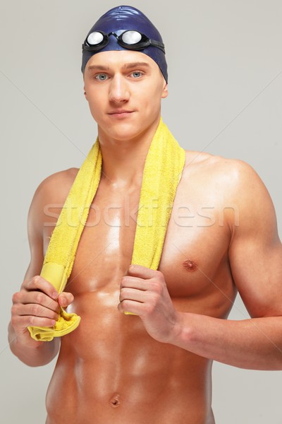 Young athletic man with towel in swimming cap and googles  Stock photo © Nejron