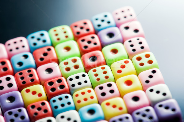 Plastic colorful dices over glass surface Stock photo © Nejron