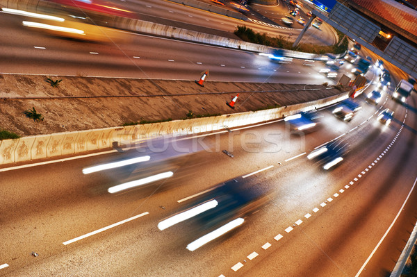 Fast moving cars at night Stock photo © Nejron