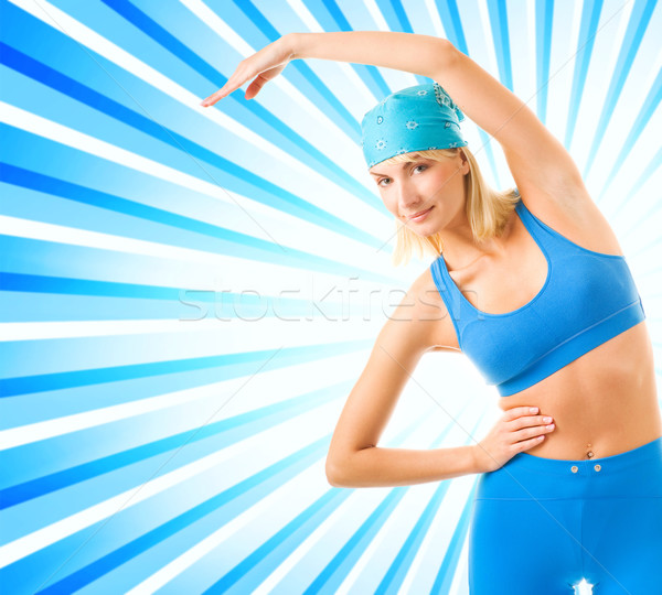 Beautiful young fitness trainer over abstract background Stock photo © Nejron