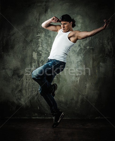 Man dancer showing break-dancing moves Stock photo © Nejron