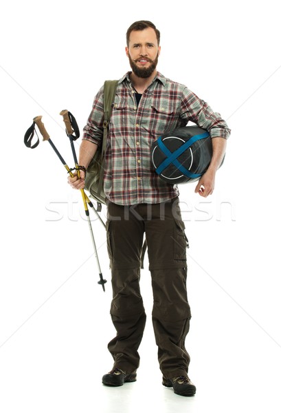 Traveler with backpack, hiking poles and sleeping bag  Stock photo © Nejron