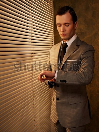 Man with a glass near a window Stock photo © Nejron