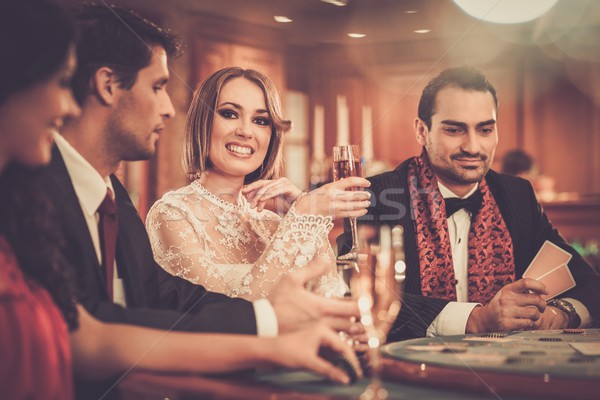Group of stylish people playing in a casino Stock photo © Nejron