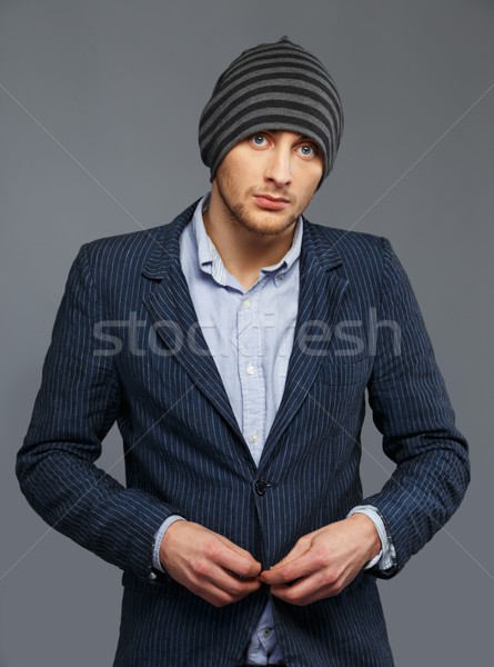 Stylish young man in jacket and beanie hat  Stock photo © Nejron