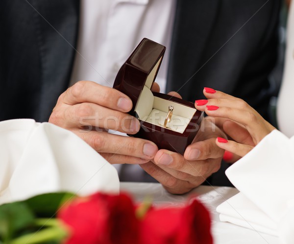 Man holding box with ring making propose to his girlfriend Stock photo © Nejron