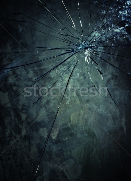 Broken glass over grey background. Stock photo © Nejron