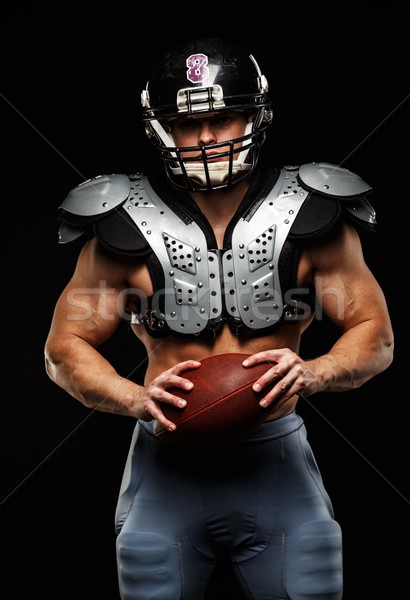 American football player with ball wearing helmet and protective shields  Stock photo © Nejron
