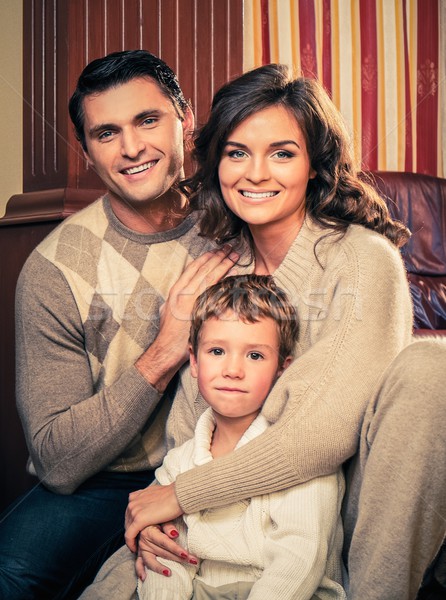 Family in warm cashmere clothes in home interior  Stock photo © Nejron