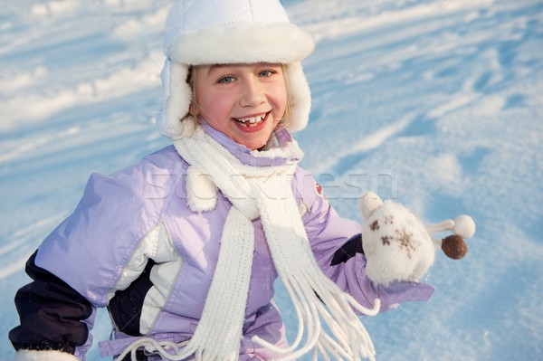 Funny little girl running in the snow  Stock photo © Nejron
