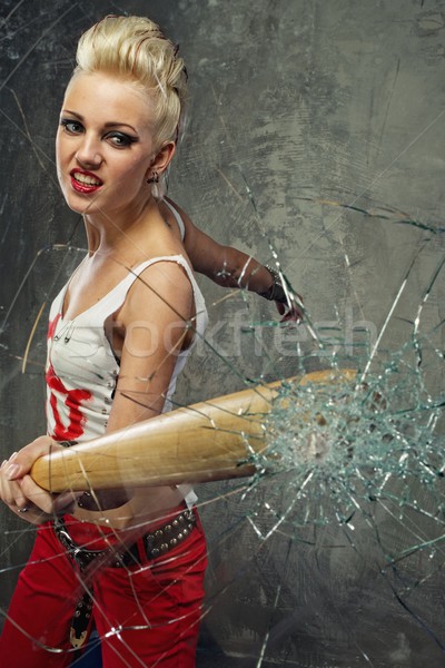 Punk girl broking a glass with a bat Stock photo © Nejron