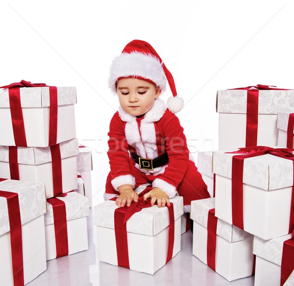 Baby boy in Santa Claus costume with a gift boxes Stock photo © Nejron