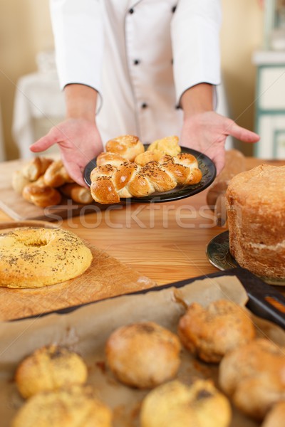 Woman hands holding plate with homemade baked goods Stock photo © Nejron