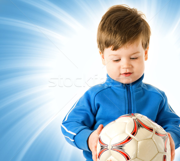 Handsome boy with soccer ball over abstract blue background Stock photo © Nejron