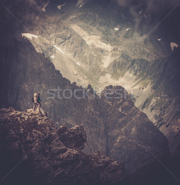Couple of hikers on a top of a mountain  Stock photo © Nejron