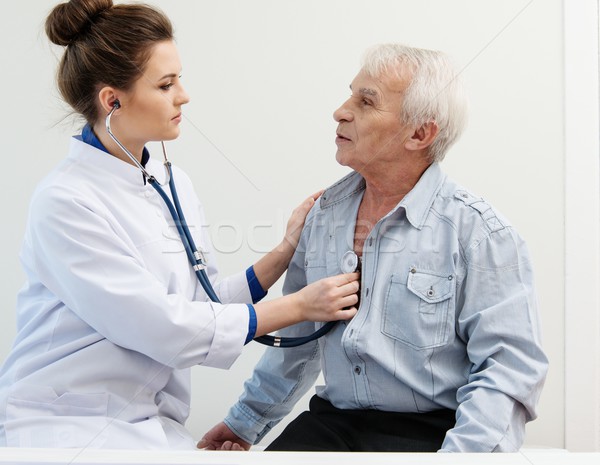Senior man and doctor woman with stethoscope Stock photo © Nejron