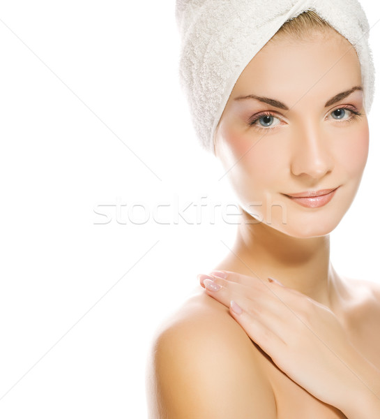 Young lovely lady applying moisturizer to her skin after shower Stock photo © Nejron