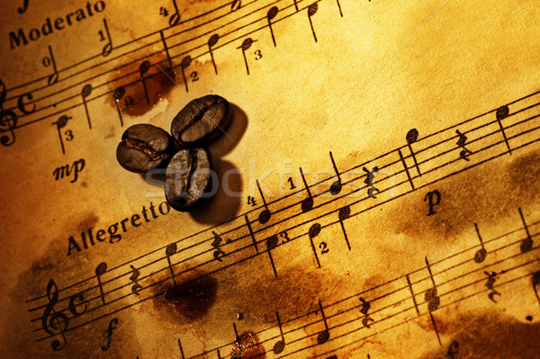 Stock photo: Coffee beans on a grungy musical background