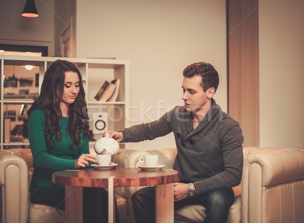 Young couple drinking coffee during discussion Stock photo © Nejron