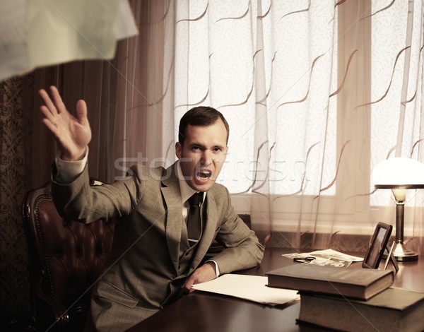 Angry businessman throwing a documents Stock photo © Nejron