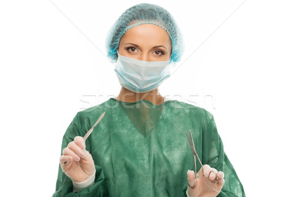 Young woman doctor with surgery scalpel and scissors Stock photo © Nejron