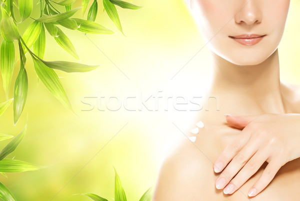 Beautiful young woman applying organic cosmetics to her skin Stock photo © Nejron
