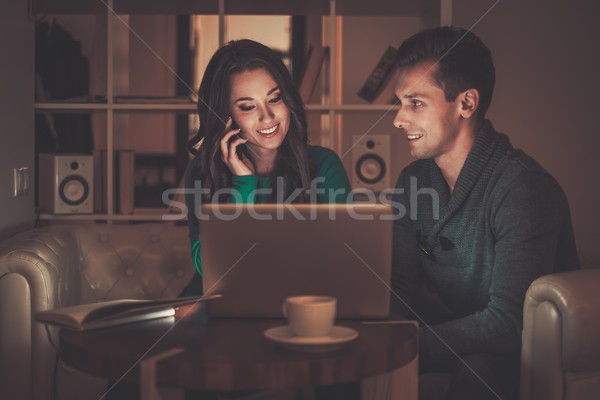Young couple behind laptop discussing something  Stock photo © Nejron