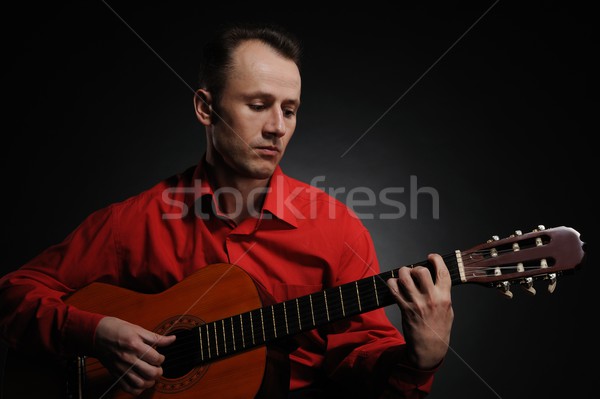 Handsome man playing guitar Stock photo © Nejron