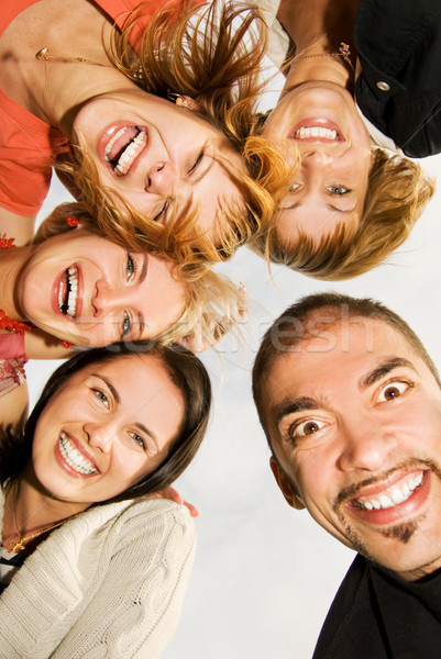 Group of happy friends making funny faces Stock photo © Nejron