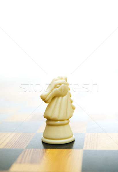 Stock photo: Knight figure on chessboard