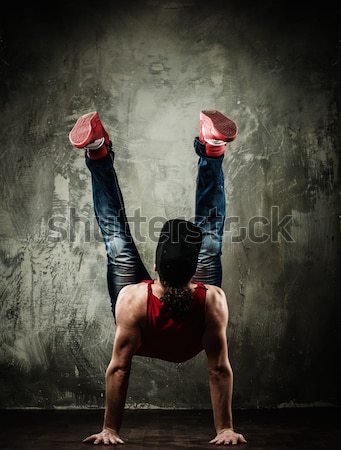 Young b-boy man with naked torso doing brake dancing movements  Stock photo © Nejron