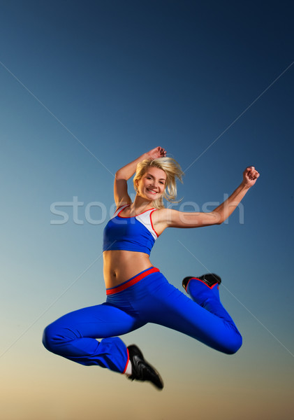 Beutiful woman jumping outdoors Stock photo © Nejron