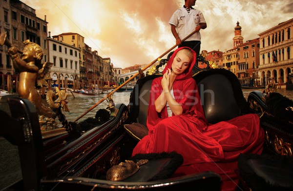 Gyönyörű nő piros köpeny lovaglás gondola épület Stock fotó © Nejron