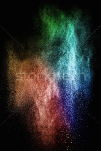 Colourful powder exploding isolated on black Stock photo © Nejron