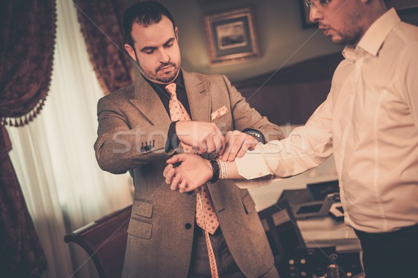 Tailor measuring client for custom made suit tailoring  Stock photo © Nejron