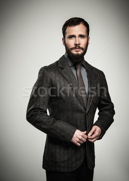Handsome man with beard wearing jacket  Stock photo © Nejron