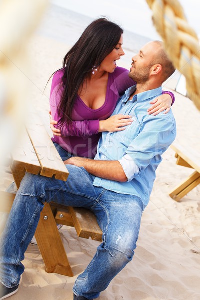 Feliz sorridente casal praia mulher Foto stock © Nejron