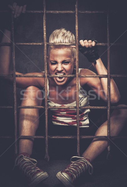 Troubled teenager girl behind bars Stock photo © Nejron