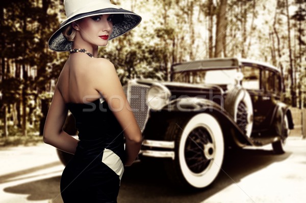 Woman in hat against retro car. Stock photo © Nejron