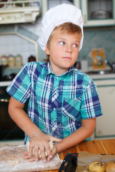 Stock photo: Young cook boy making homemade pastry